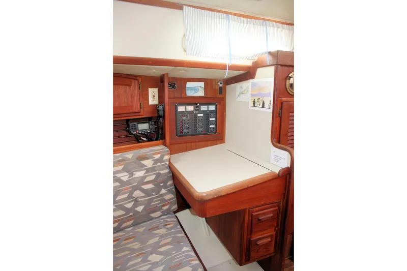 Slide: The Image of Interior of 1991 Ericson 380 sailboat with navigation station and seating area. - 55