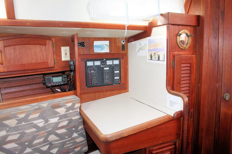 Slide: The Image of Interior of 1991 Ericson 380 sailboat with navigation station and wooden cabinetry. - 56