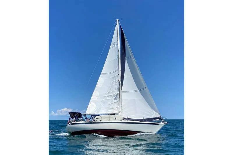 Slide: The Image of Sailing yacht Ericson 38-200, 1993 model, gliding on open sea under clear blue sky. - 6