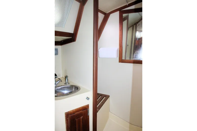 Slide: The Image of Interior of 1991 Ericson 380 sailboat bathroom with sink and mirror. - 62