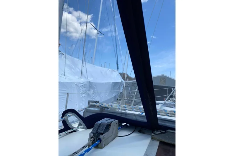 Slide: The Image of Sailboat deck view of a 1993 Ericson 38-200 under clear blue skies. - 7