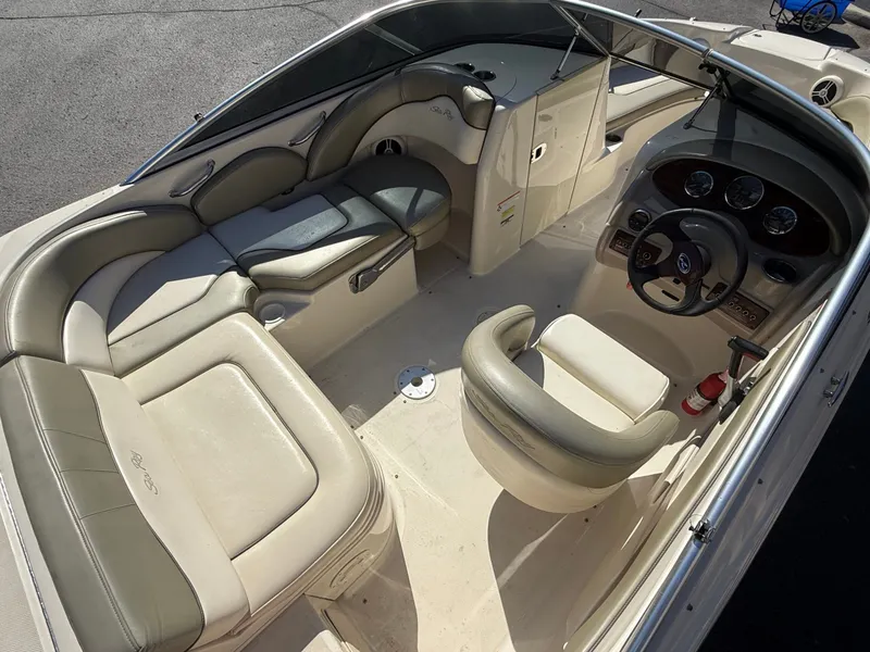 Slide: The Image of Interior of a 2006 Sea Ray 200 Sundeck boat with seating. - 17