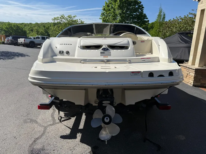 Slide: The Image of Rear view of a 2006 Sea Ray 200 Sundeck boat on a trailer. - 23