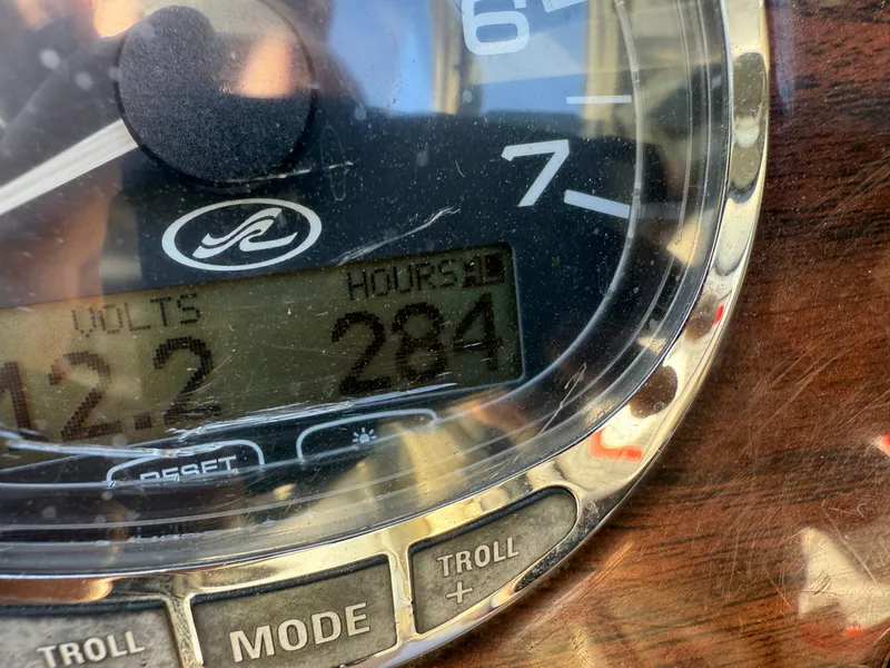 Slide: The Image of Close-up of a 2006 Sea Ray Sundeck tachometer displaying 284 hours. - 26