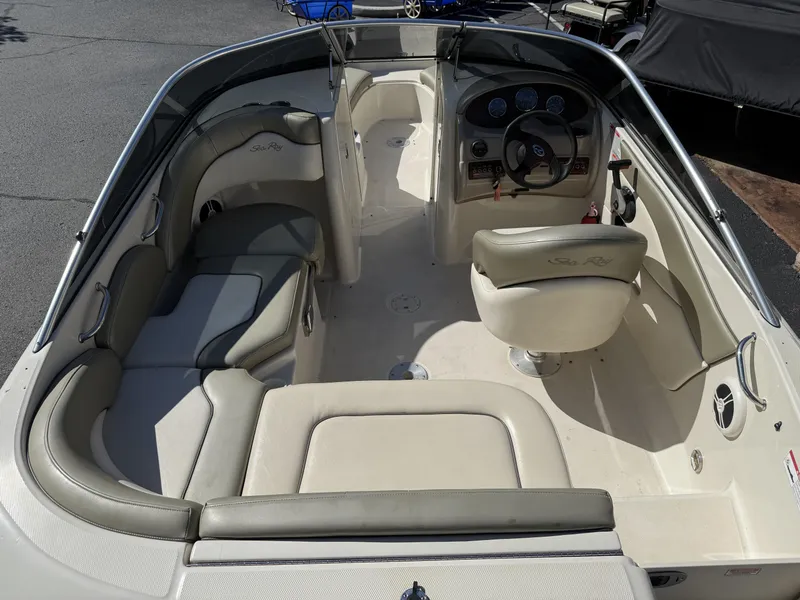 Slide: The Image of Interior of a 2006 Sea Ray 200 Sundeck boat with seating area. - 3