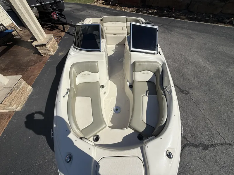 Slide: The Image of 2006 Sea Ray 200 Sundeck boat with open cabin and seating. - 5