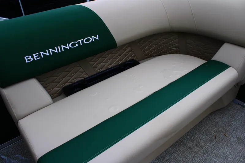 Slide: The Image of Bennington 21 SSRSF 2026 boat seat with green and beige upholstery. - 7