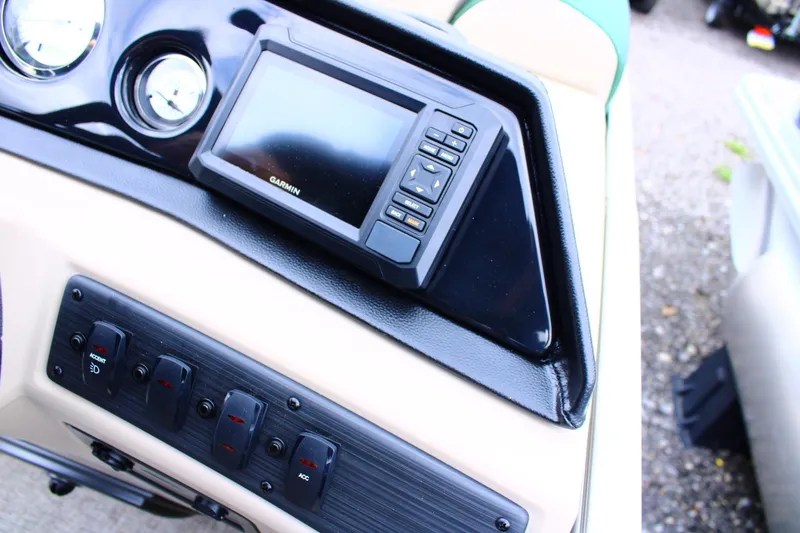 Slide: The Image of Dashboard of 2026 Bennington 21 SSRSF with Garmin navigation system and control switches. - 9