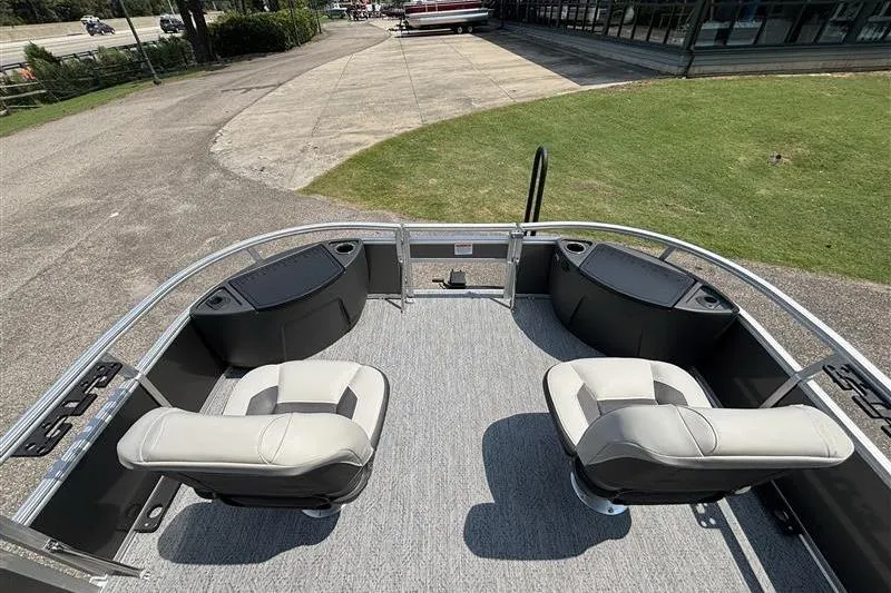 Slide: The Image of 2026 Sun Tracker Bass Buggy 18 DLX pontoon boat with seating and storage compartments. - 8