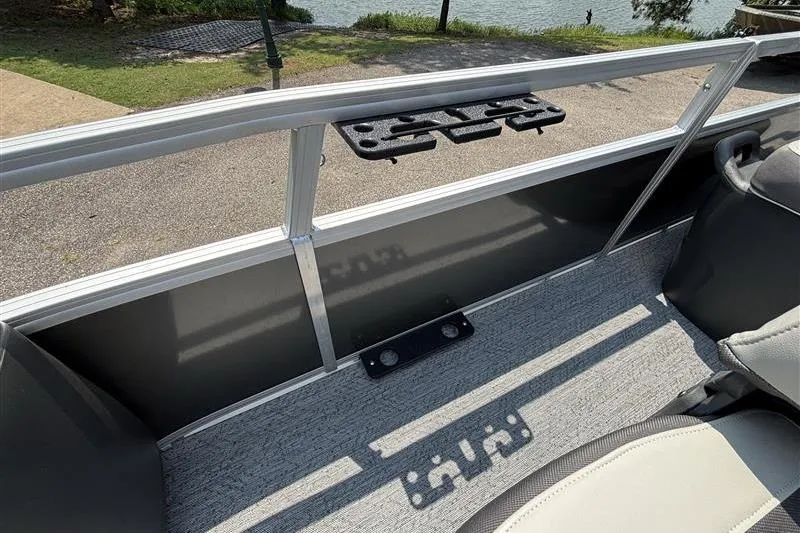 Slide: The Image of 2026 Sun Tracker Bass Buggy 18 DLX interior with seating and railing detail. - 12