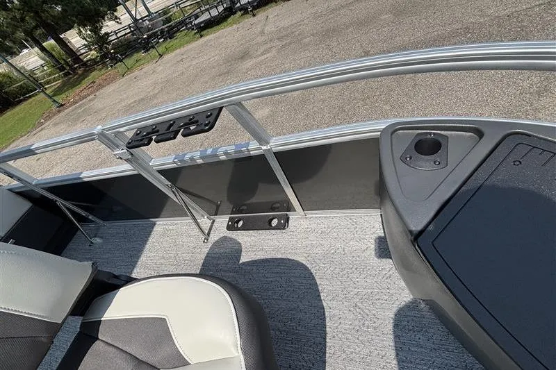 Slide: The Image of Interior view of 2026 Sun Tracker Bass Buggy 18 DLX pontoon boat with seating and railing. - 13