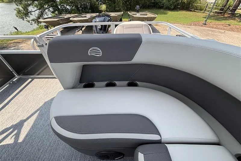 Slide: The Image of 2026 Sun Tracker Bass Buggy 18 DLX pontoon boat with comfortable seating and cup holders. - 21