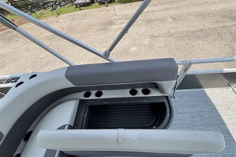 Slide: The Image of 2026 Sun Tracker Bass Buggy 18 DLX pontoon boat seating with storage compartment. - 23