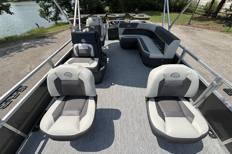 Slide: The Image of 2026 Sun Tracker Bass Buggy 18 DLX pontoon boat interior with comfortable seating and spacious layout. - 6