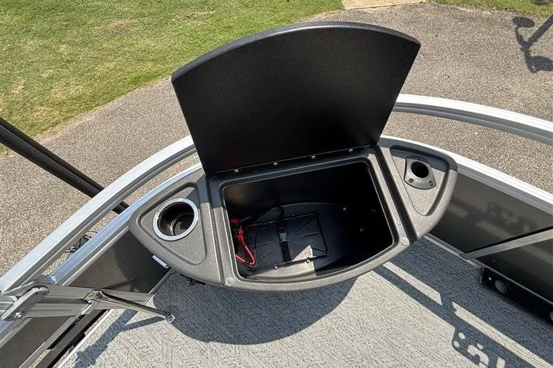 Slide: The Image of Open storage compartment on 2026 Sun Tracker Bass Buggy 18 DLX pontoon boat. - 11
