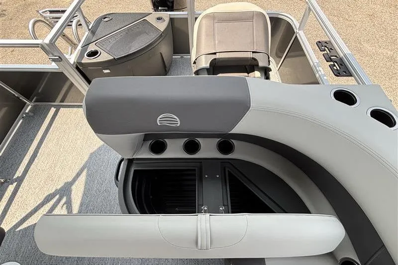 Slide: The Image of 2026 Sun Tracker Bass Buggy 18 DLX interior with seating and storage compartments. - 22