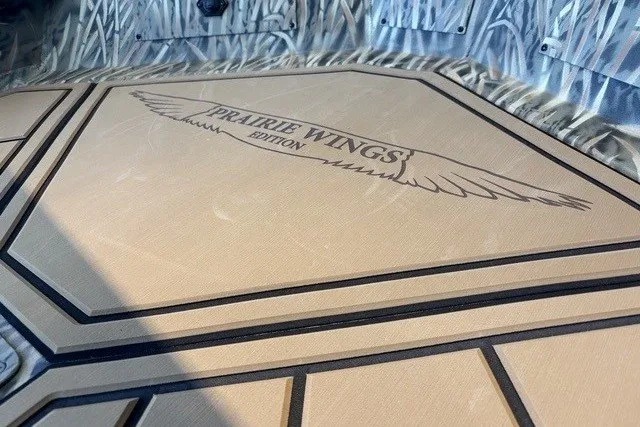 Slide: The Image of 2026 Tracker Grizzly 1650 T Prairie Wings Edition interior with custom flooring design. - 7