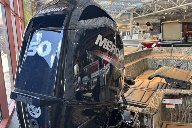Slide: The Image of 2026 Tracker Grizzly 1650 T Prairie Wings Edition with Mercury 50 engine in showroom. - 11
