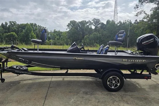 Slide: The Image of 2026 Ranger RT188C fishing boat with Mercury engine on trailer, parked outdoors. - 4