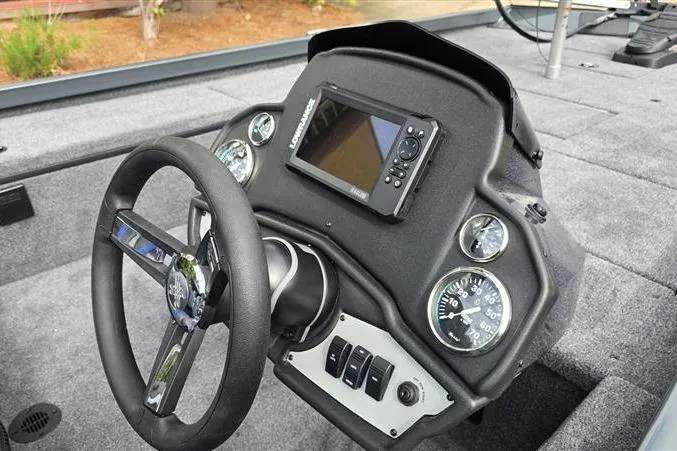 Slide: The Image of 2026 Ranger RT188C boat dashboard with steering wheel and electronic display. - 10