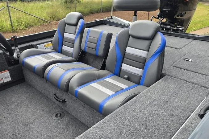 Slide: The Image of 2026 Ranger RT188C boat interior with gray and blue cushioned seats. - 12