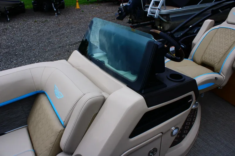 Slide: The Image of 2026 Bennington 22MSB boat interior with beige seating and blue accents. - 10