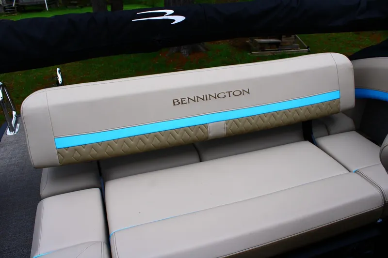 Slide: The Image of 2026 Bennington 22MSB boat seat with beige upholstery and blue accents. - 11