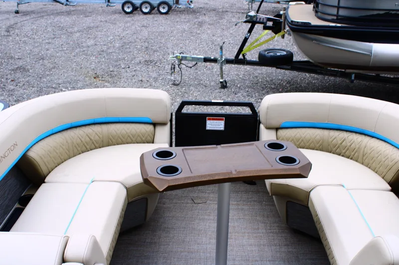 Slide: The Image of 2026 Bennington 22MSB boat interior with beige seating and cup holders. - 5