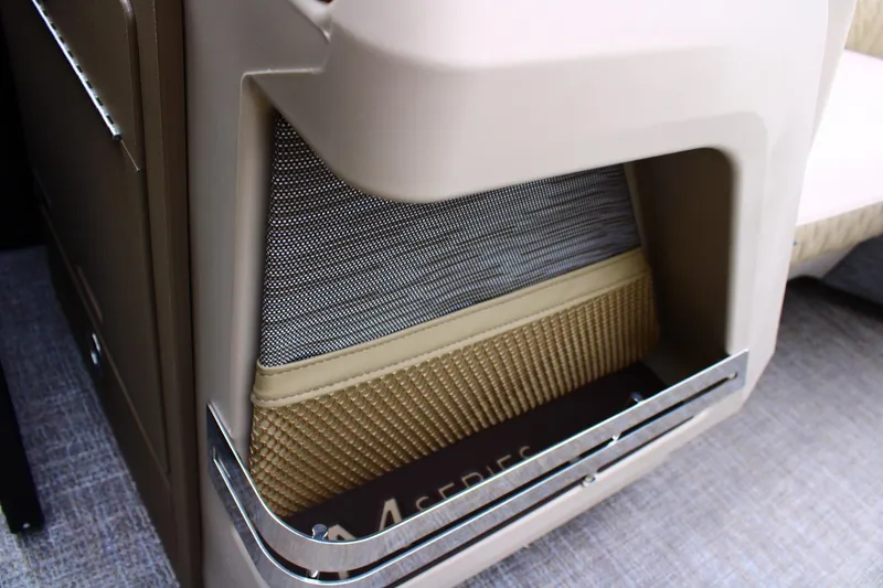 Slide: The Image of Interior storage compartment of 2026 Bennington 22MSB boat, featuring sleek design and mesh pocket. - 7