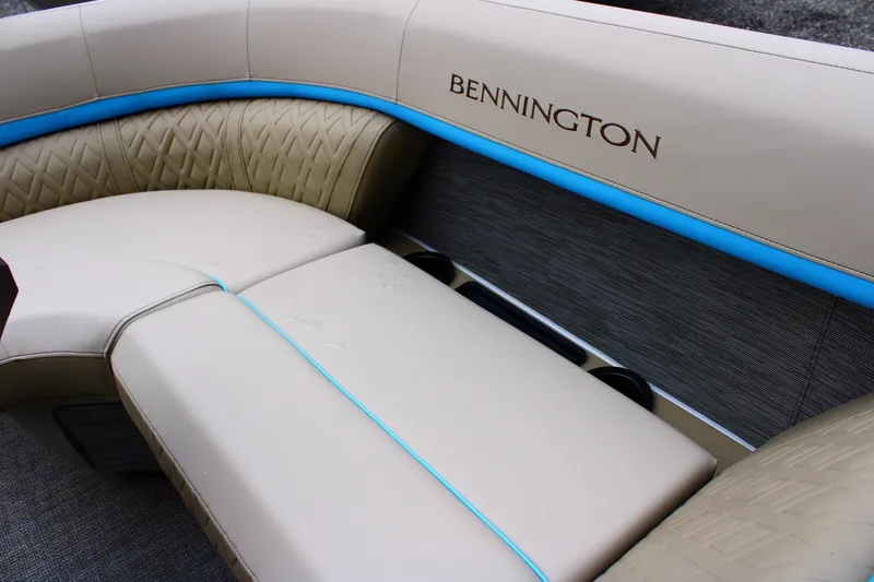 Slide: The Image of Luxurious seating on 2026 Bennington 22MSB boat with beige upholstery and blue accents. - 9
