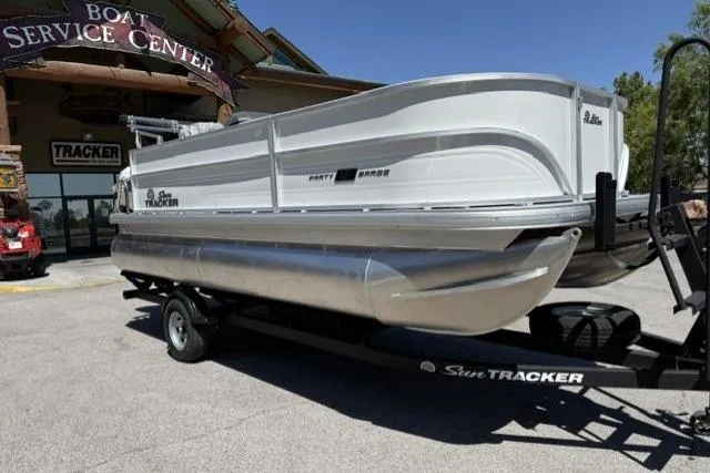 The Image of 2026 Sun Tracker Party Barge 18 DLX pontoon boat on trailer at service center. - 0