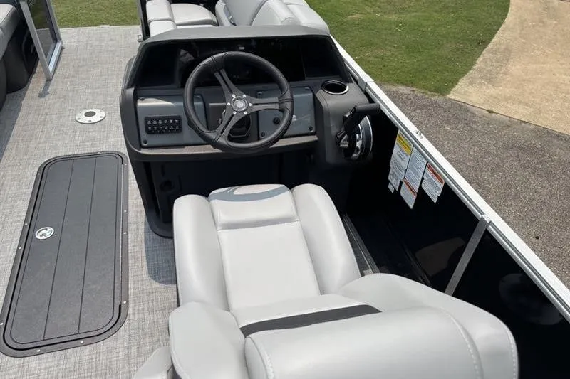 Slide: The Image of Interior view of 2026 Sun Tracker Party Barge 22 RF XP3 pontoon boat cockpit. - 11
