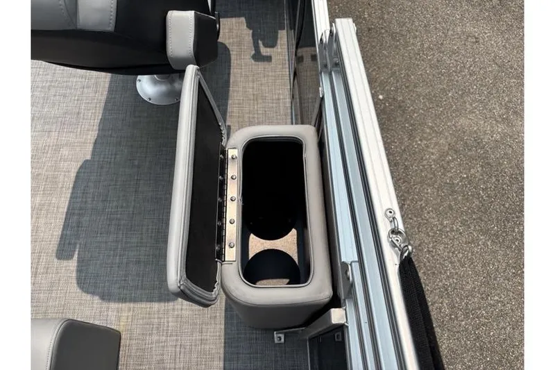 Slide: The Image of 2026 Sun Tracker Party Barge 22 RF XP3 cup holder and storage compartment detail. - 18
