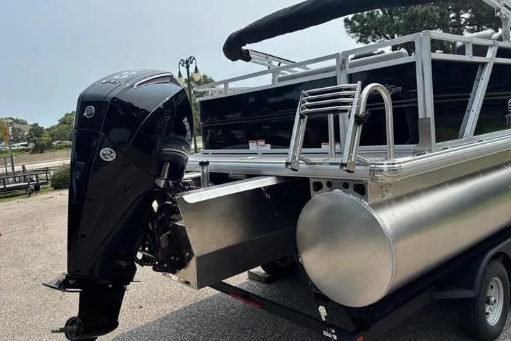 Slide: The Image of 2026 Sun Tracker Party Barge 22 RF XP3 pontoon boat with powerful outboard motor. - 2