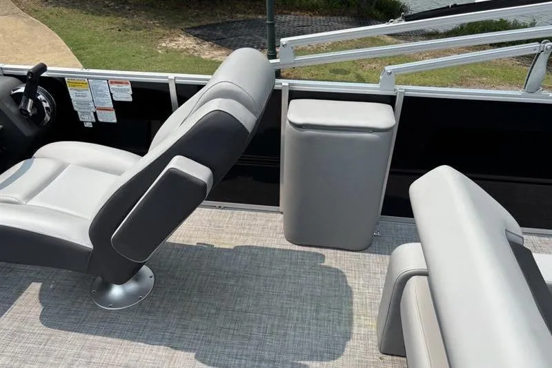 Slide: The Image of Interior of 2026 Sun Tracker Party Barge 22 RF XP3 with gray seating and steering console. - 12