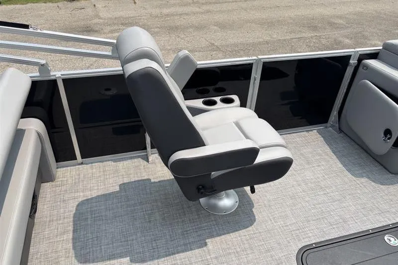Slide: The Image of 2026 Sun Tracker Party Barge 22 RF XP3 interior with comfortable seating and cup holders. - 13