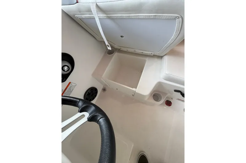 Slide: The Image of Interior view of 2026 Tahoe T16 boat, featuring steering wheel and storage compartment. - 5