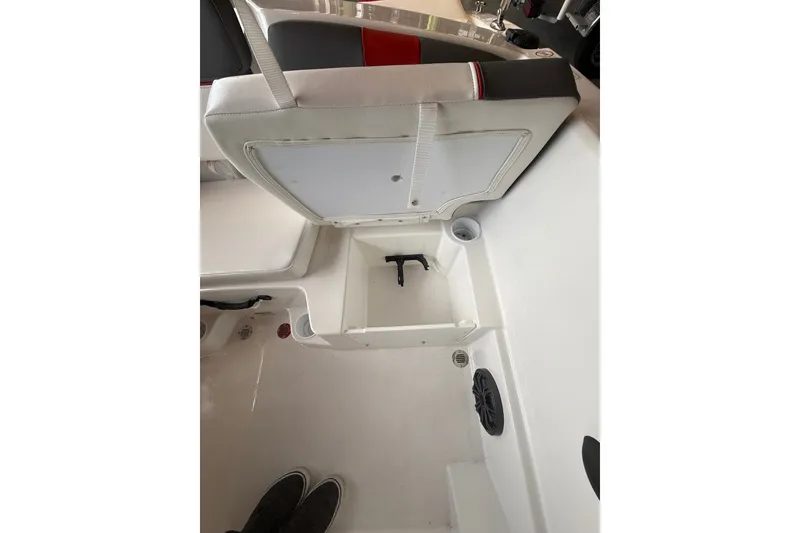 Slide: The Image of 2026 Tahoe T16 boat interior with open storage compartment and seating. - 8