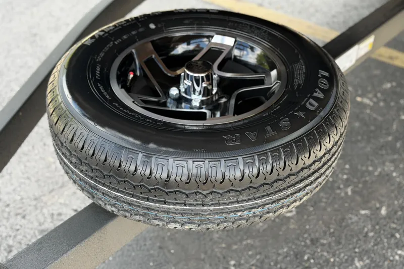 Slide: The Image of Ranger 223FC 2026 model tire with Load Star branding on a metal frame. - 11