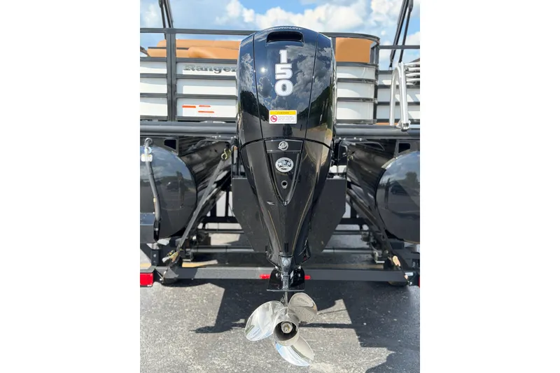 Slide: The Image of 2026 Ranger 223FC boat with a powerful 150 HP outboard motor, rear view. - 4