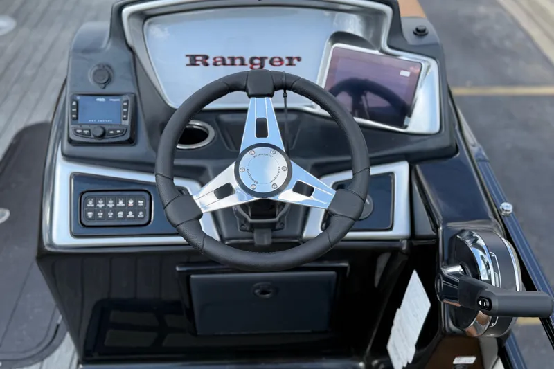 Slide: The Image of Steering console of 2026 Ranger 223FC boat with modern controls and sleek design. - 17