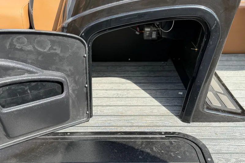 Slide: The Image of Interior view of a 2026 Ranger 223FC boat, showcasing seating and storage area. - 15