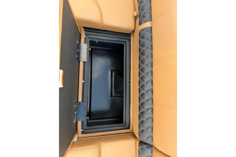 Slide: The Image of 2026 Ranger 223FC storage compartment with tan and gray quilted upholstery. - 24