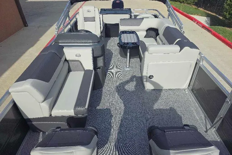 Slide: The Image of 2026 Sun Tracker Fishin' Barge 20 DLX interior with spacious seating and modern design. - 6