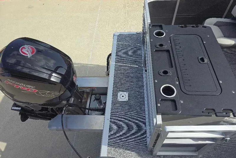 Slide: The Image of 2026 Sun Tracker Fishin' Barge 20 DLX with Mercury outboard motor and fishing station. - 17