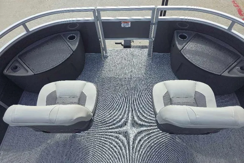 Slide: The Image of 2026 Sun Tracker Fishin' Barge 20 DLX interior with two cushioned seats and storage compartments. - 9