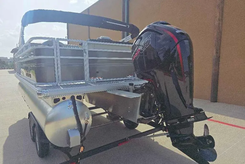 Slide: The Image of 2026 Sun Tracker Fishin' Barge 20 DLX pontoon boat with powerful outboard motor. - 5