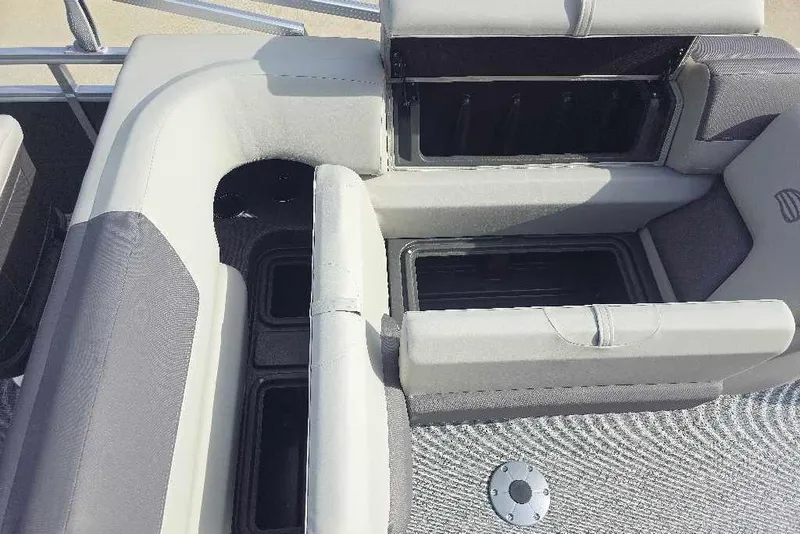 Slide: The Image of Interior seating and storage of 2026 Sun Tracker Fishin' Barge 20 DLX pontoon boat. - 13