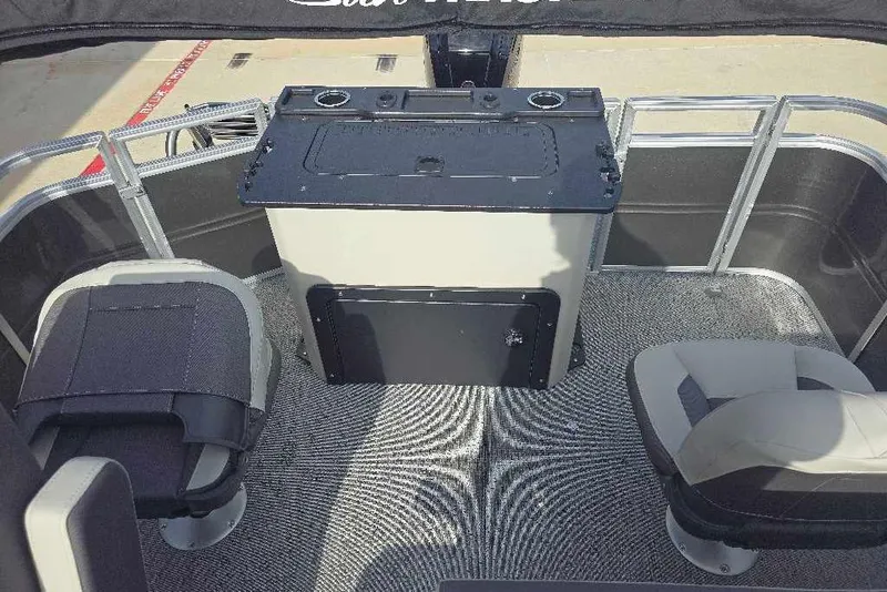 Slide: The Image of 2026 Sun Tracker Fishin' Barge 20 DLX interior with seating and console. - 15