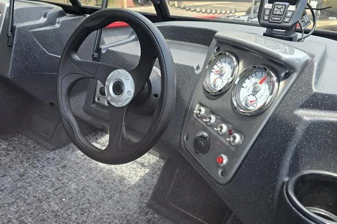 Slide: The Image of 2026 Tracker Pro Guide V-16 WT dashboard with steering wheel and instrument panel. - 7